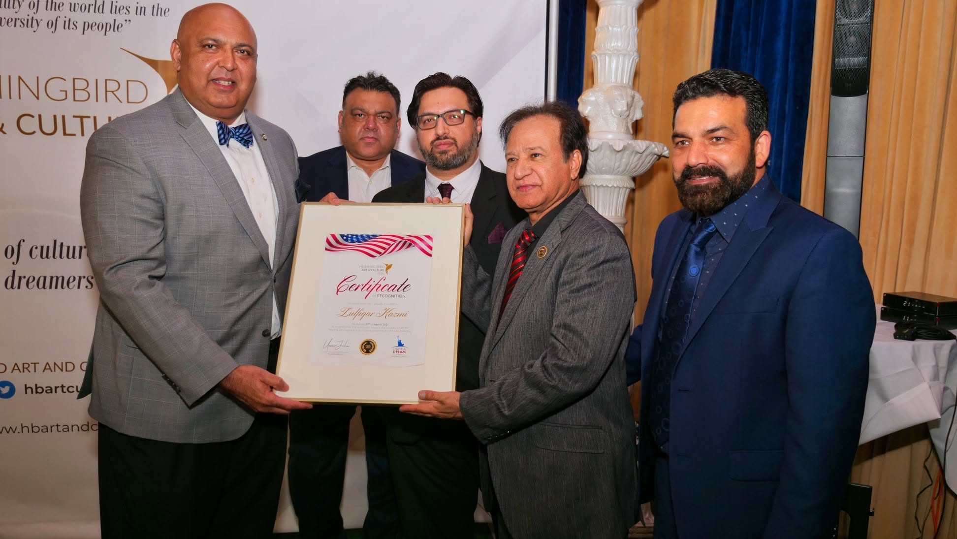 Zulfiqar Kazmi receiving the Certificate of Recognition